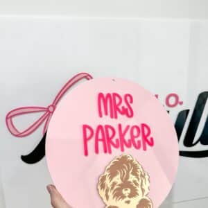 Personalised acrylic name sign on a plain background.