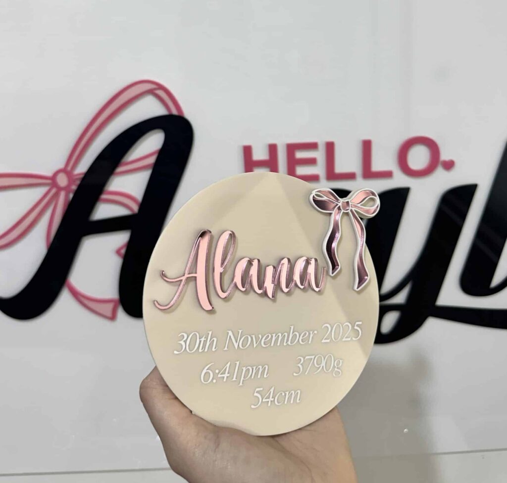 Personalised clear acrylic sign displaying a custom name or message for home or office.