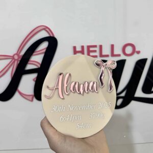 Personalised clear acrylic sign displaying a custom name or message for home or office.