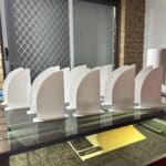 Personalised acrylic wall name sign photographed against a plain background.