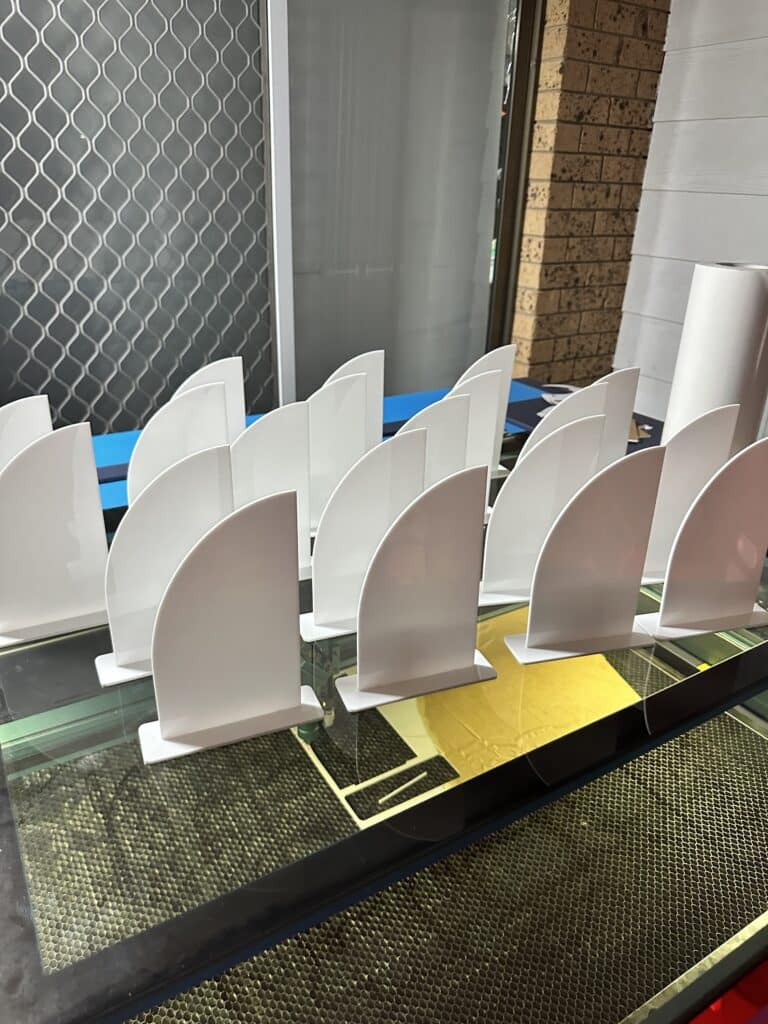 Personalised acrylic name sign on a plain background with crisp, slim lettering.