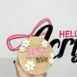 Personalised acrylic name plaque with laser-engraved lettering on clear acrylic.