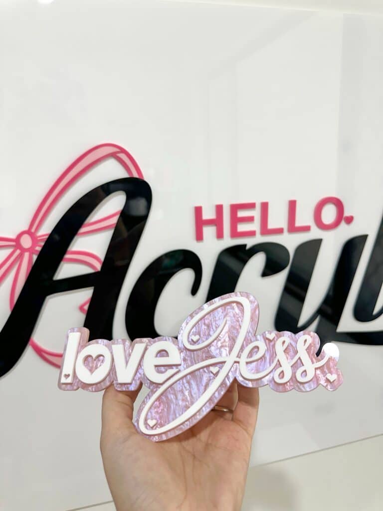 Laser‑engraved personalised acrylic sign on a clear panel.