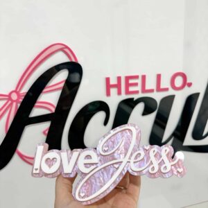 Laser‑engraved personalised acrylic sign on a clear panel.