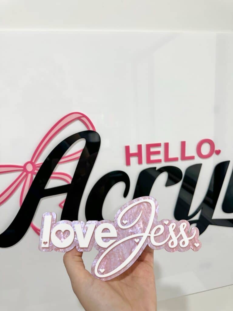 Personalised acrylic name plaque with laser-engraved lettering for gifts or home.