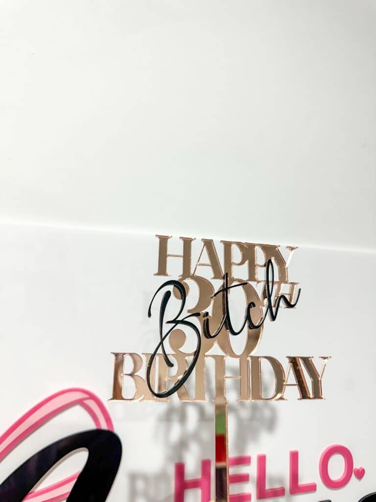 Personalised acrylic name sign on a neutral background.