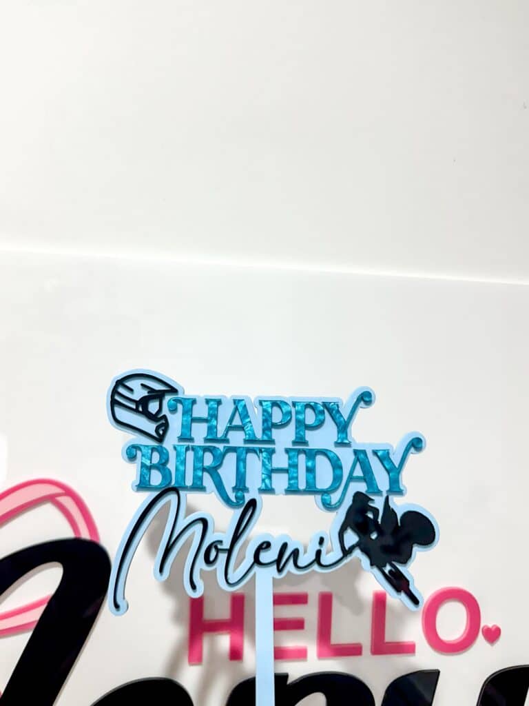 Clear personalised acrylic name plaque with laser-engraved cursive text.