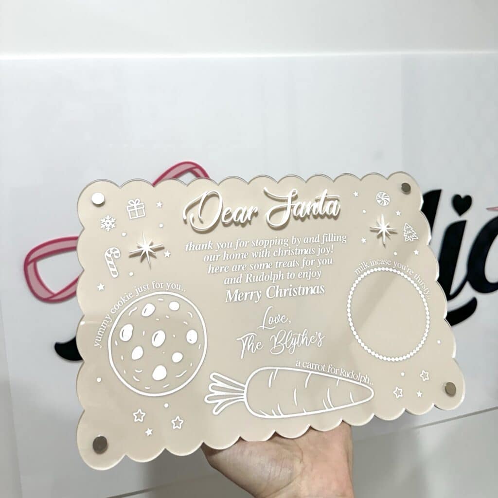 Personalised acrylic name sign freestanding on a table for room décor or gifting.