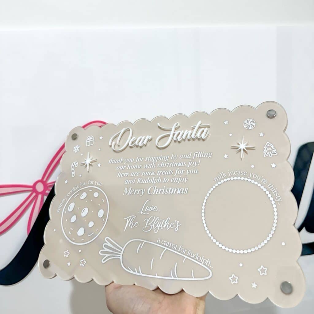 Personalised acrylic name display sign on a neutral background.