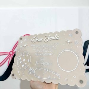 Personalised acrylic name display sign on a neutral background.