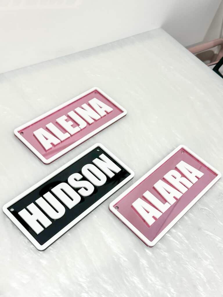layered acrylic name plate with mirrored finish, custom ride-on name plate for kids vehicles.