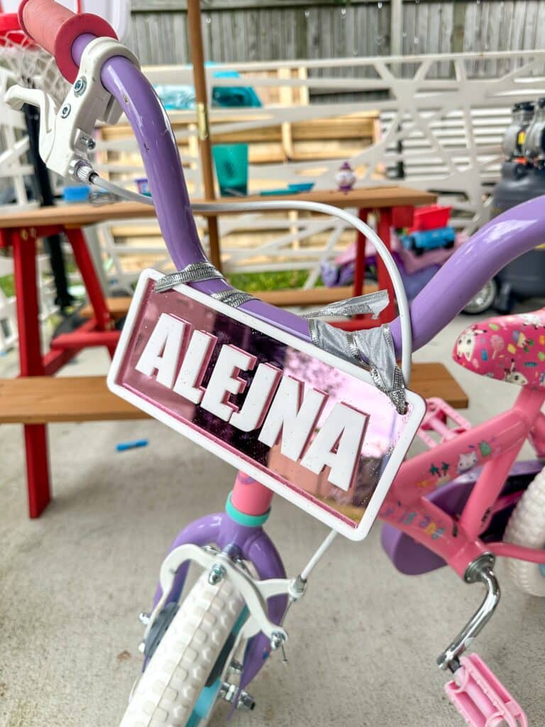 layered acrylic name plate with mirrored finish, custom ride-on name plate for kids vehicles.