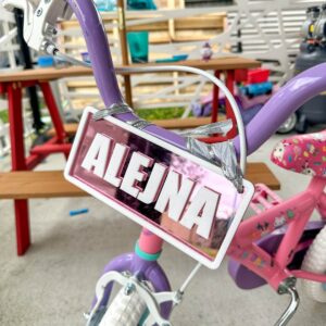 layered acrylic name plate with mirrored finish, custom ride-on name plate for kids vehicles.