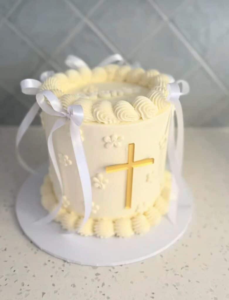 acrylic cross cake charm for baptism and communion, frosted with a satin finish.