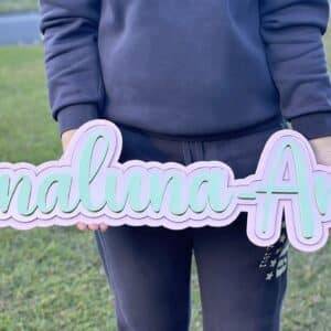 A triple layer acrylic name sign, personalised with a 3D effect, offering a unique and eye-catching decorative piece.