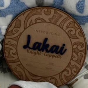 Personalised baby announcement plaque featuring Maori New Zealand art, with pēpi's name in acrylic and additional names.