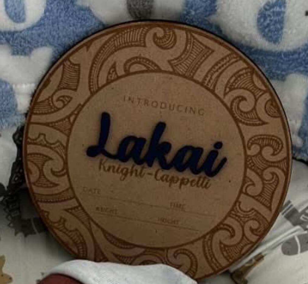 Personalised baby announcement plaque featuring Maori New Zealand art, with pēpi's name in acrylic and additional names.
