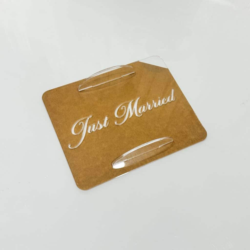 Acrylic cake topper set with cursive "Just Married" design, for a Tiramisu themed wedding. Personalised cake decoration.