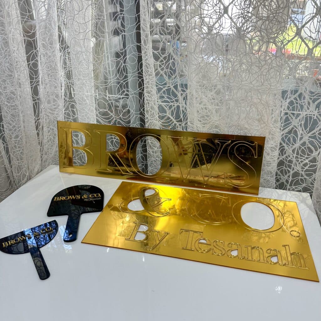 acrylic business wall signage with custom 3D lettering, personalised, gold mirror finish.