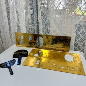 acrylic business wall signage with custom 3D lettering, personalised, gold mirror finish.
