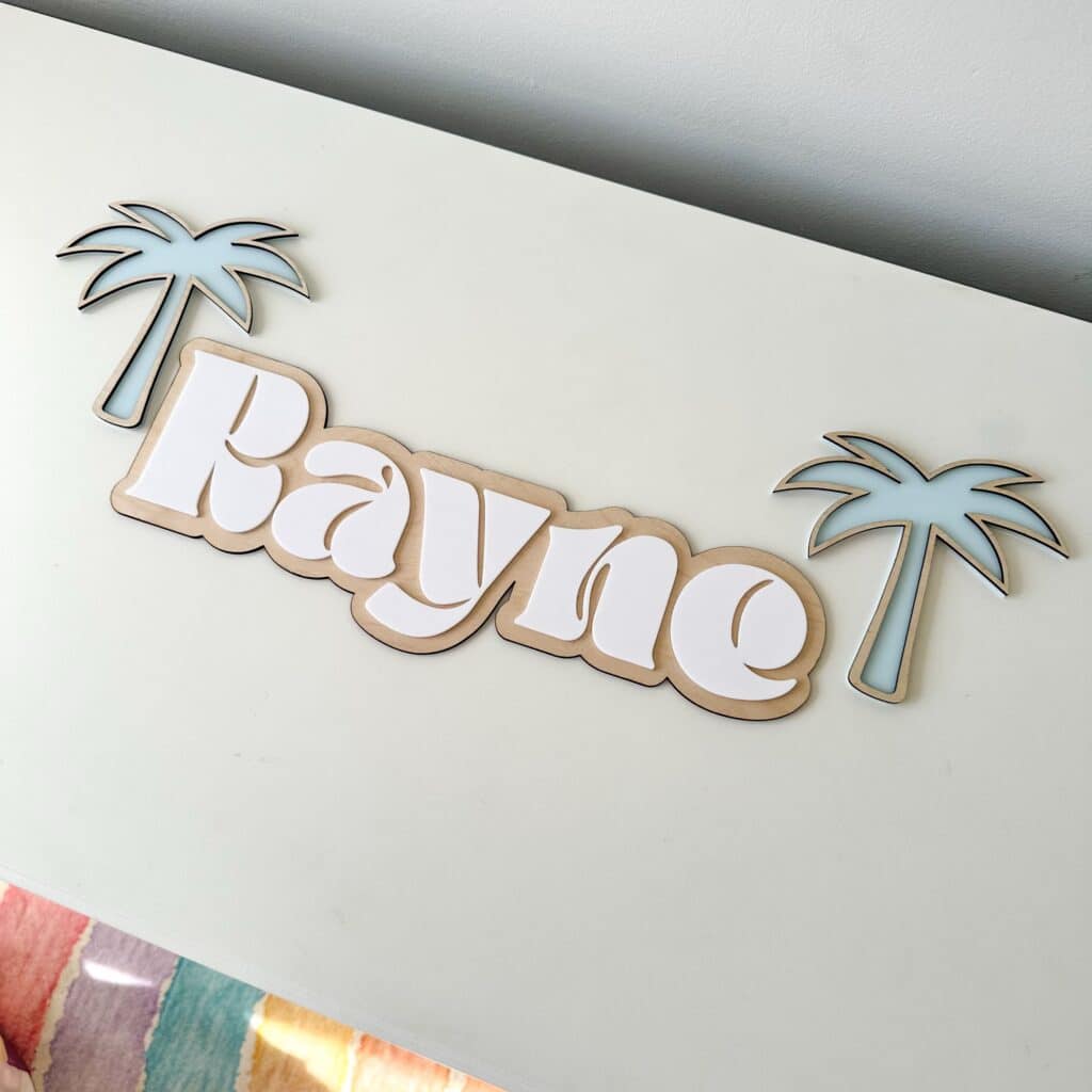 Custom double layer swirl font acrylic name sign, featuring a personalised name in a layered acrylic design.