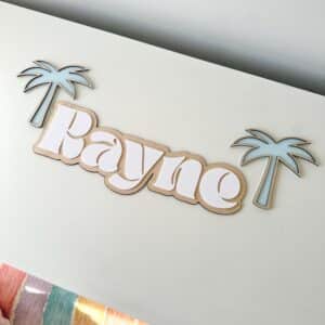 Custom double layer swirl font acrylic name sign, featuring a personalised name in a layered acrylic design.