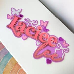 acrylic personalised name sign with butterfly and heart motifs. Custom, triple-layered, layered acrylic.