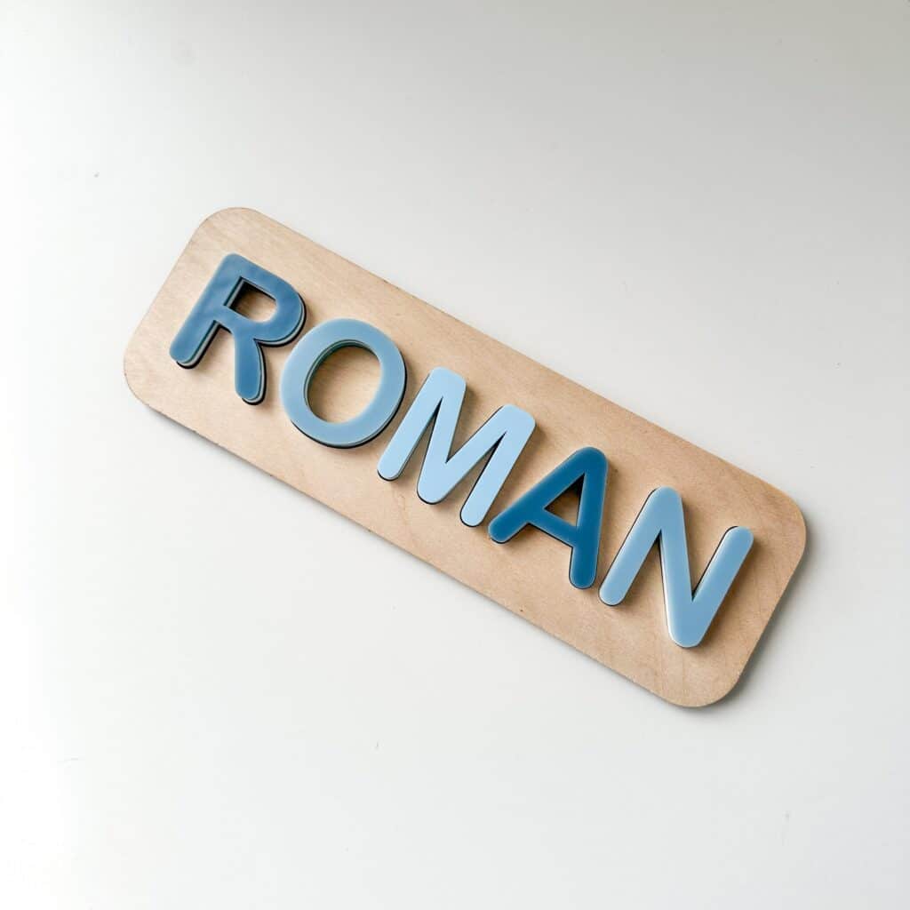 A custom, handcrafted, wooden and layered acrylic name puzzle for kids, featuring a personalisation option for a special.
