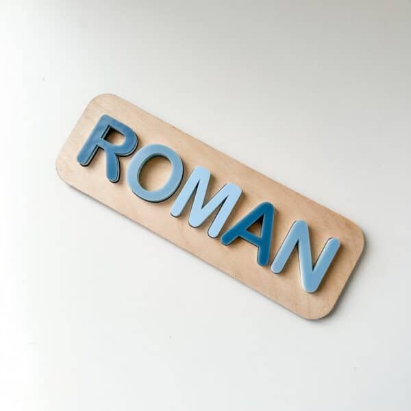 A custom, handcrafted, wooden and layered acrylic name puzzle for kids, featuring a personalisation option for a special.